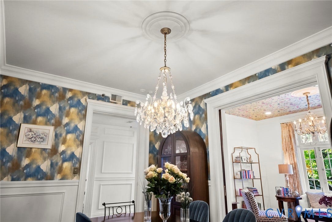 2416 Park Avenue, #U4, The Fan District, Richmond, VA 23220 Ornate crystal chandelier with central ceiling medallion, extensive crown molding, decorative wainscoting, and bold patterned wallpaper