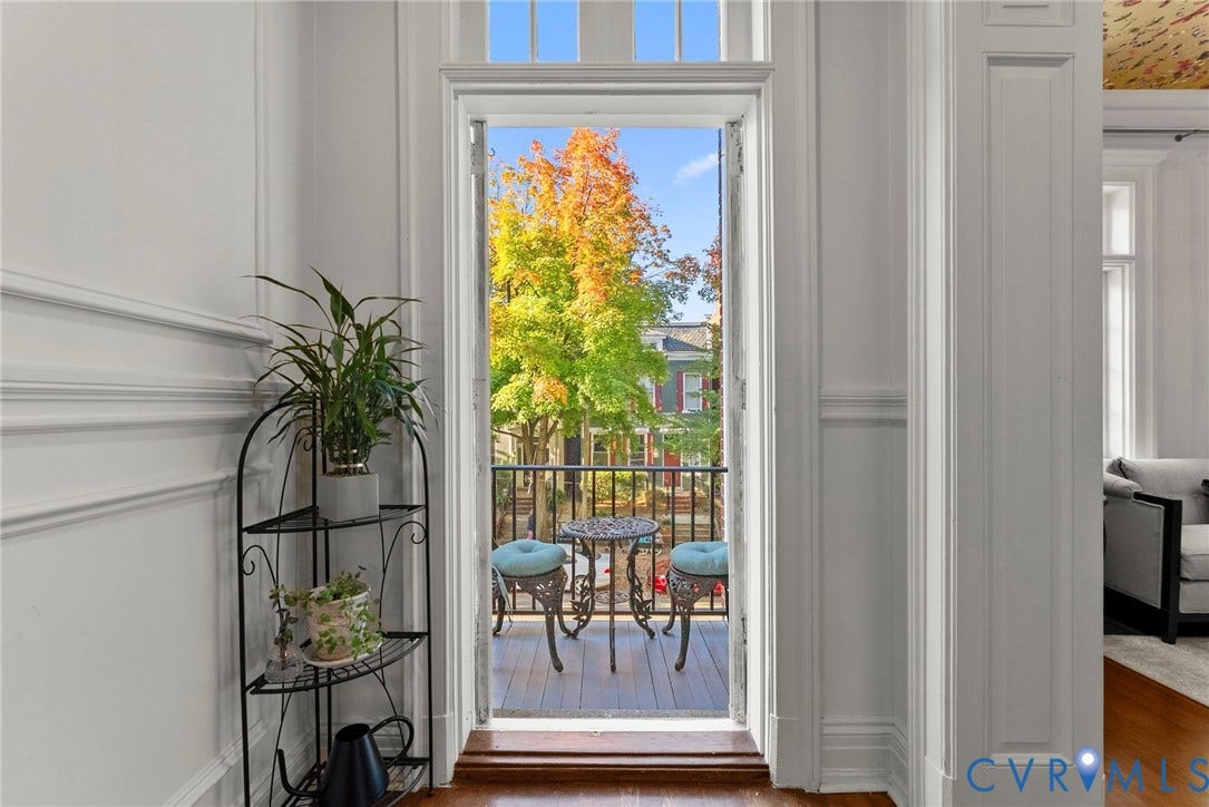 2416 Park Avenue, #U4, The Fan District, Richmond, VA 23220 French door with glass transom light, interior millwork, and balcony featuring a metal railing