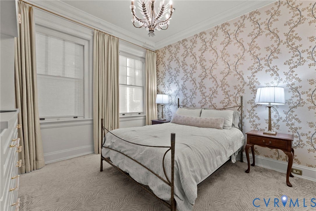 2416 Park Avenue, #U4, The Fan District, Richmond, VA 23220 Interior room featuring patterned wallpaper, crown molding, double-hung windows, and a decorative chandelier