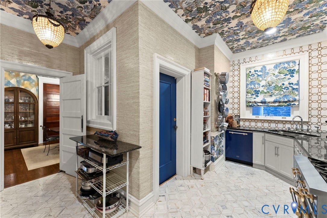 2416 Park Avenue, #U4, The Fan District, Richmond, VA 23220 Textured wall coverings, patterned ceiling detailing, built-in shelving, geometric tile flooring, and decorative hanging light fixtures