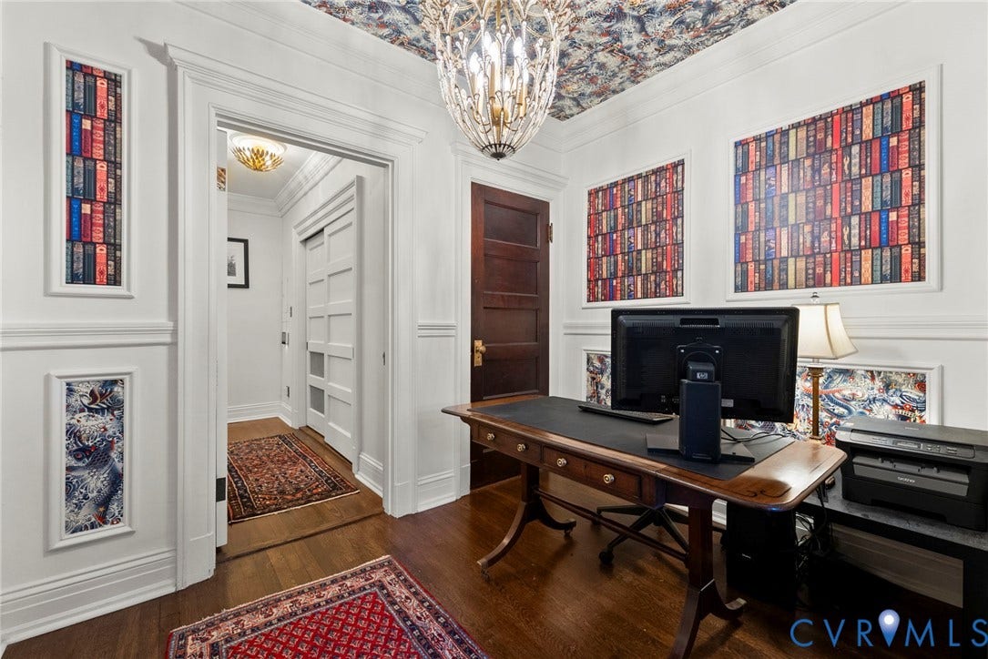 2416 Park Avenue, #U4, The Fan District, Richmond, VA 23220 Intricate crown molding and wall paneling, elaborate patterned ceiling wallpaper, polished wood-finish flooring, solid wood five-panel door, and a multi-tiered crystal chandelier
