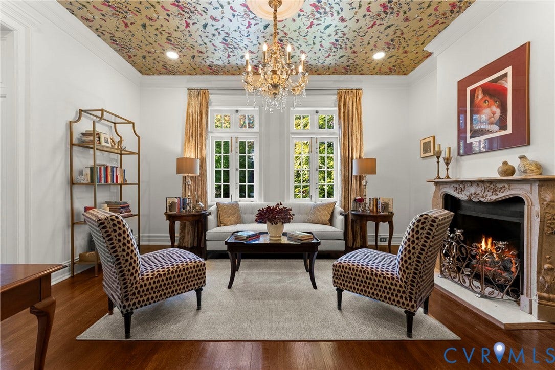 2416 Park Avenue, #U4, The Fan District, Richmond, VA 23220 Intricate patterned ceiling treatment, crystal chandelier, ornate carved fireplace surround, multi-pane windows, and wood-finish flooring