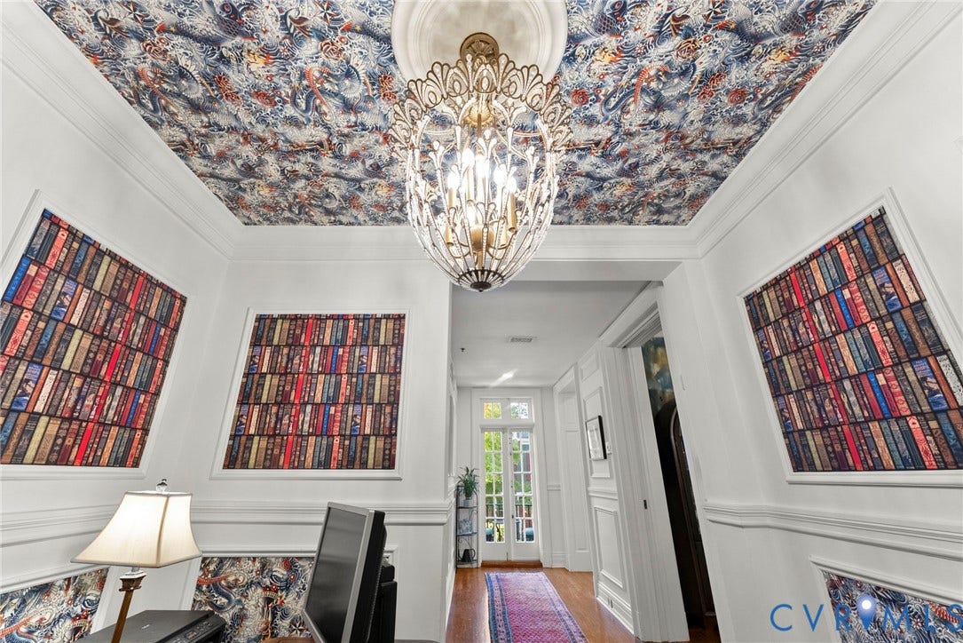 2416 Park Avenue, #U4, The Fan District, Richmond, VA 23220 Intricate patterned ceiling wallpaper with matching wall panel inserts, ornate metal chandelier, central ceiling medallion, and white wainscoting