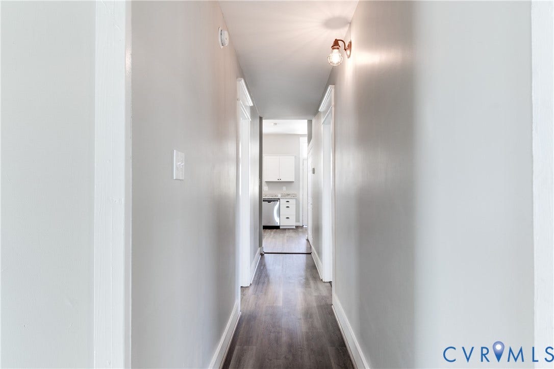 620 Chimborazo Boulevard, Church Hill, Richmond, VA 23223 Interior hallway featuring wood-finish flooring, neutral wall tones, and a wall-mounted light fixture