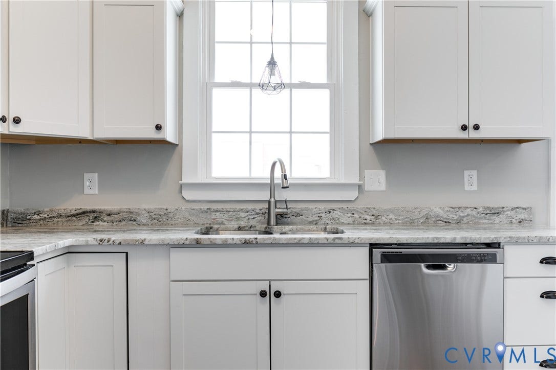 620 Chimborazo Boulevard, Church Hill, Richmond, VA 23223 Kitchen featuring white shaker-style cabinetry, stone-patterned countertops, stainless steel undermount sink, brushed nickel high-arch faucet, and stainless steel dishwasher