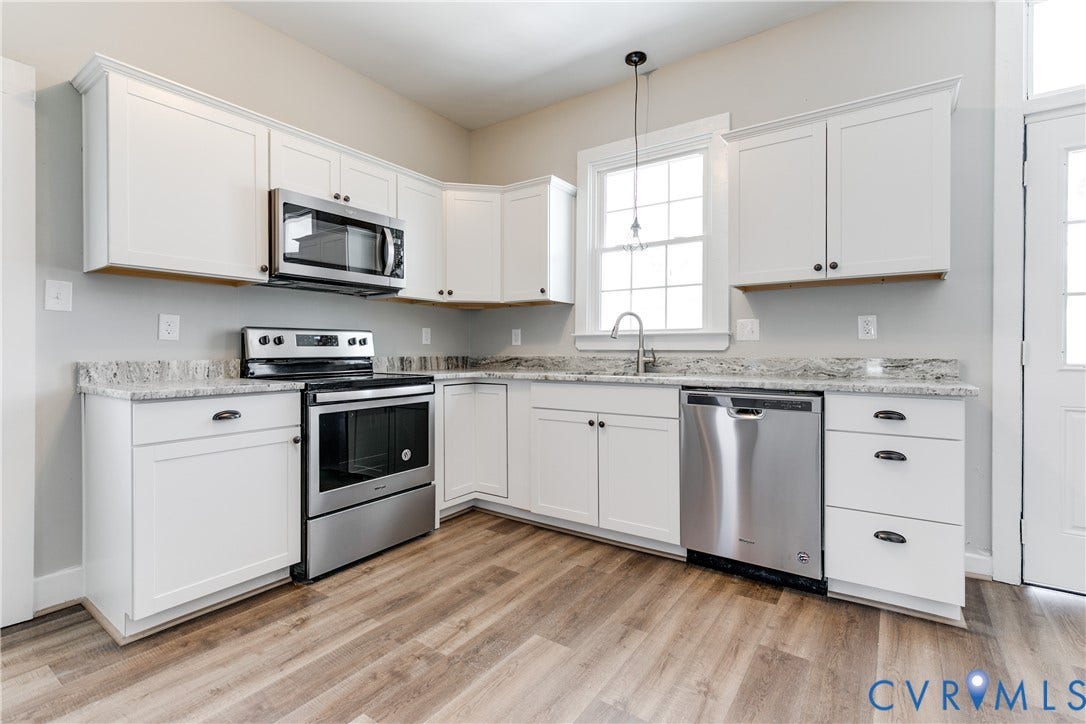 620 Chimborazo Boulevard, Church Hill, Richmond, VA 23223 Kitchen featuring white cabinetry, stone-finish countertops, stainless steel appliances, and wood-finish flooring