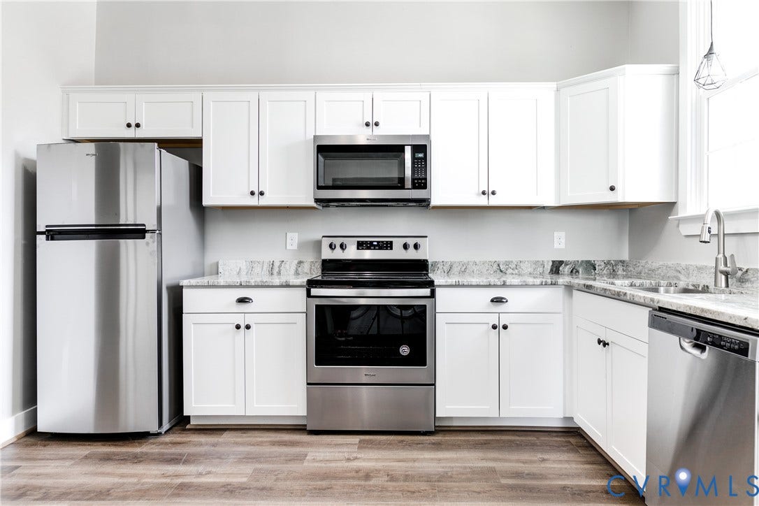 620 Chimborazo Boulevard, Church Hill, Richmond, VA 23223 Kitchen featuring white cabinetry, stone-finish countertops, stainless steel appliances, and wood-finish flooring