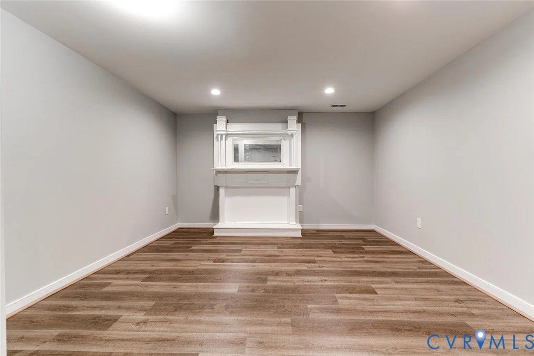 620 Chimborazo Boulevard, Church Hill, Richmond, VA 23223 Interior space featuring wood-finish flooring, neutral wall paint, recessed lighting, and a white decorative mantel with a built-in mirror