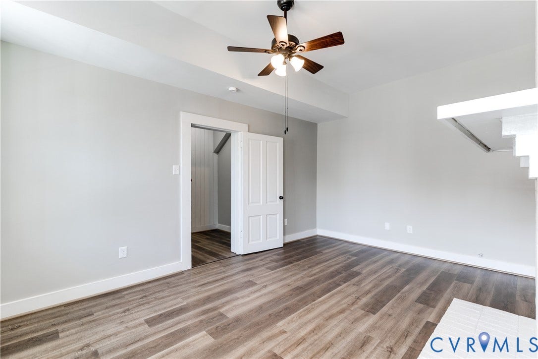 620 Chimborazo Boulevard, Church Hill, Richmond, VA 23223 Interior space featuring wood-finish flooring, a multi-paneled door, recessed ceiling detail, and a ceiling fan with integrated lighting