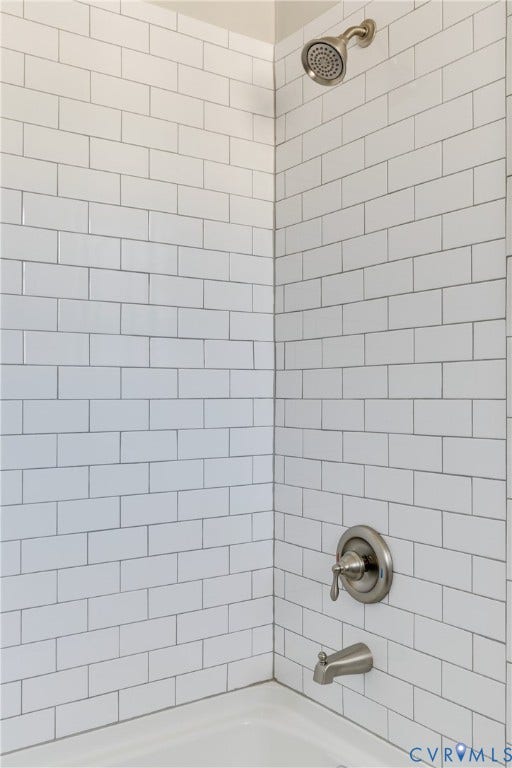 620 Chimborazo Boulevard, Church Hill, Richmond, VA 23223 Subway-tile shower surround with a brushed-nickel showerhead, single-handle pressure-balance valve, and matching tub spout