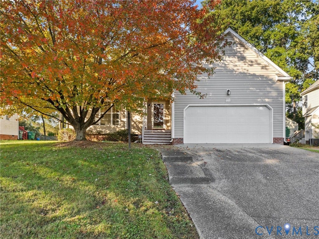 9520 Willow Ridge Drive, Glen Allen, VA 23060 Siding exterior featuring a two-car garage, concrete driveway, and covered front entryway with steps