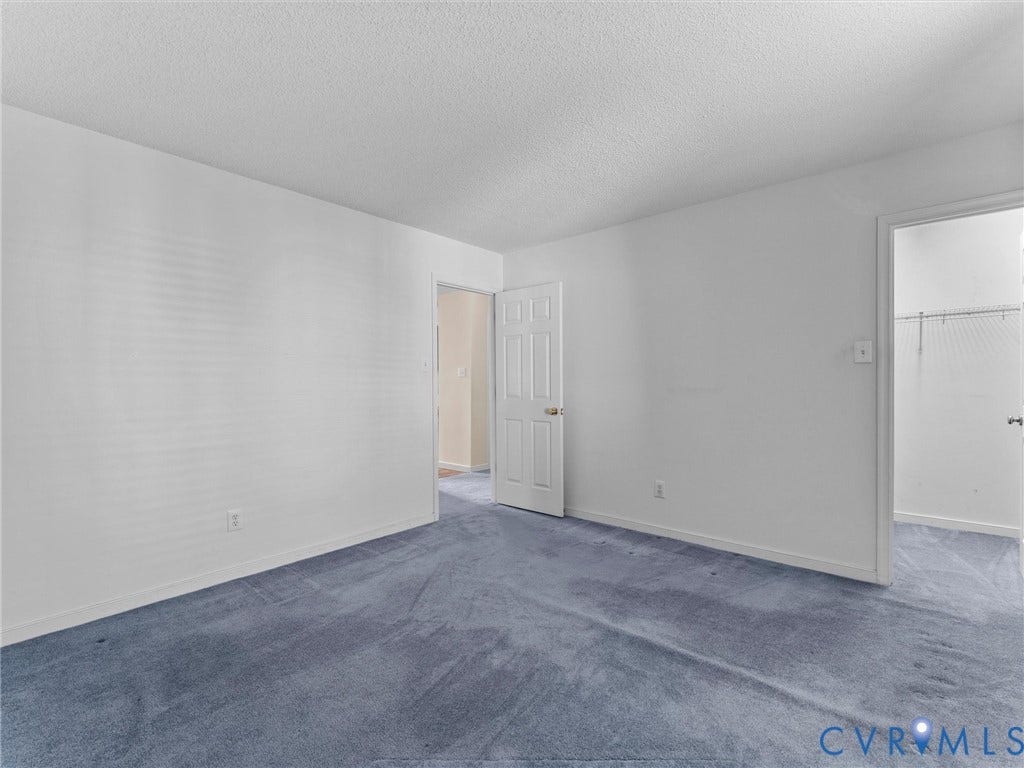 9520 Willow Ridge Drive, Glen Allen, VA 23060 Room featuring wall-to-wall carpeting, white textured ceiling, and a six-panel interior door