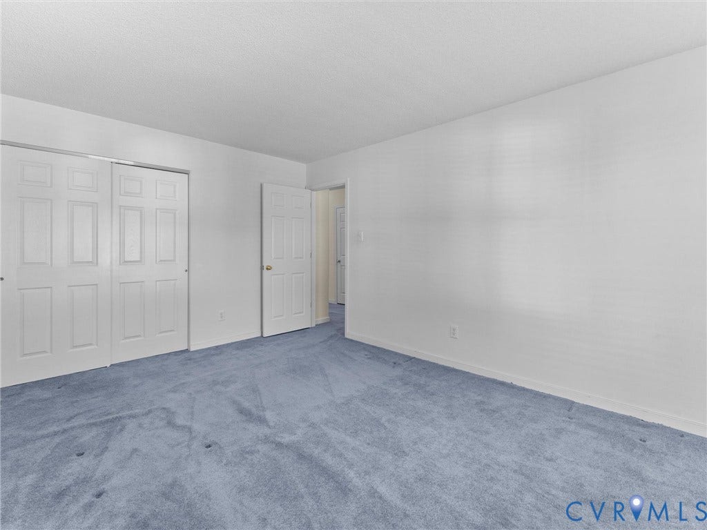 9520 Willow Ridge Drive, Glen Allen, VA 23060 Room featuring carpeting, white walls, and a multi-panel sliding closet door