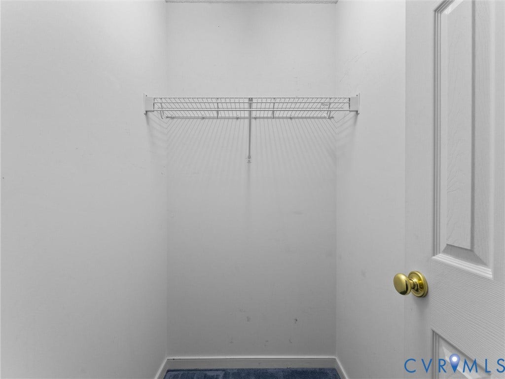 9520 Willow Ridge Drive, Glen Allen, VA 23060 Storage area featuring white paneled door with brass hardware and wire shelving