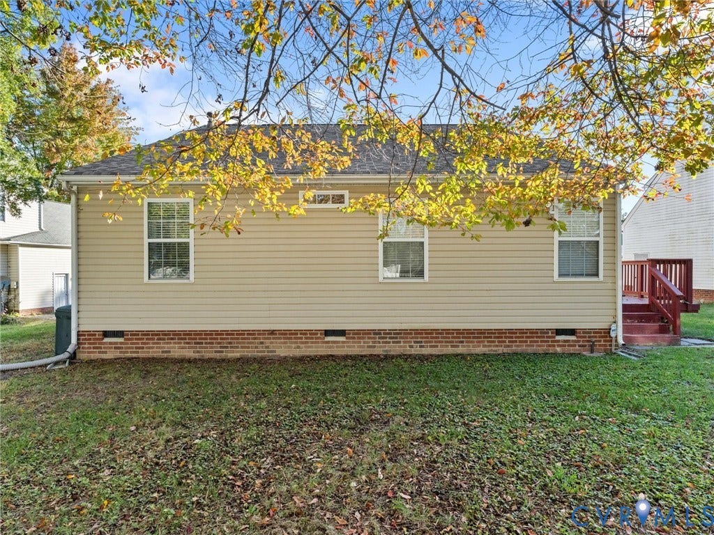 9520 Willow Ridge Drive, Glen Allen, VA 23060 Exterior featuring neutral-tone horizontal siding, a brick foundation, three windows, and a raised wooden deck