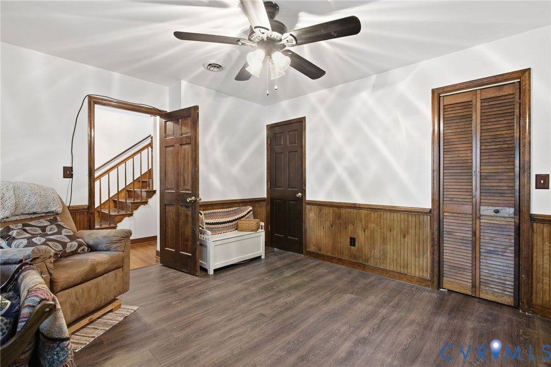 1330 Ruffin Mill Road, South Chesterfield, VA 23834 Wood-finish flooring, wood wainscoting, solid-wood six-panel doors, louvered closet doors, and ceiling fan with integrated lighting
