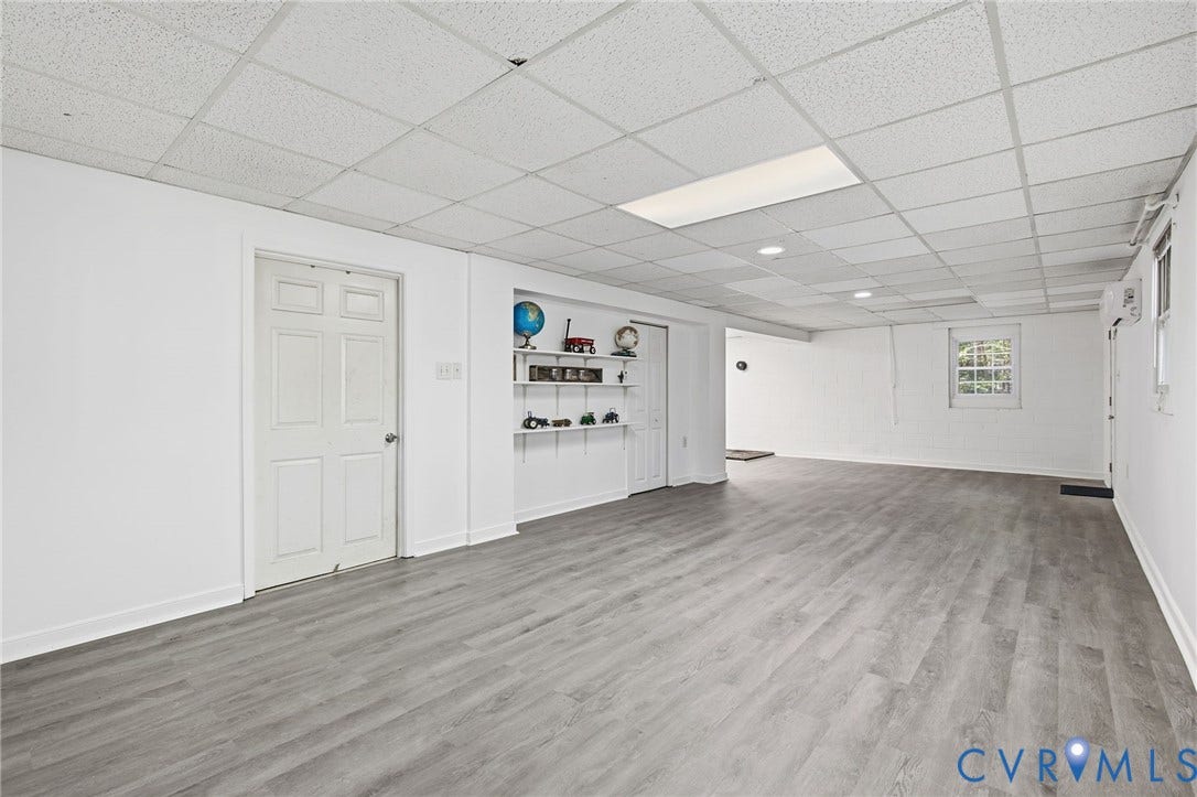 1330 Ruffin Mill Road, South Chesterfield, VA 23834 Interior space featuring wood-finish flooring, white walls, recessed ceiling lighting, a grid-pattern drop ceiling, and built-in wall shelving