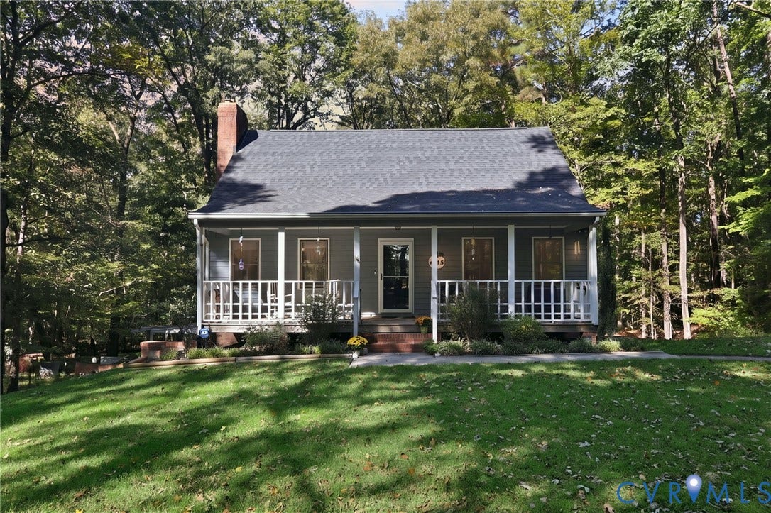 1330 Ruffin Mill Road, South Chesterfield, VA 23834 Single-story residence featuring a covered front porch, lap siding, a pitched shingle roof, an exterior brick chimney, and a mature treed lot