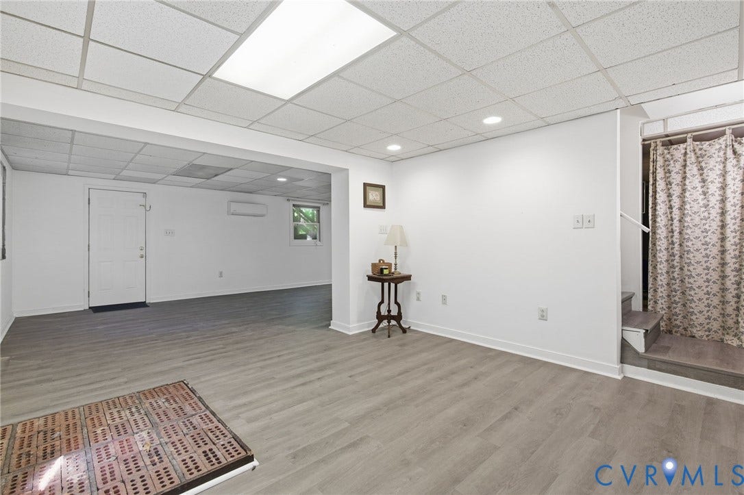 1330 Ruffin Mill Road, South Chesterfield, VA 23834 Finished interior space featuring wood-finish flooring, a drop ceiling with recessed lighting, a ductless mini-split system, and a single-panel door
