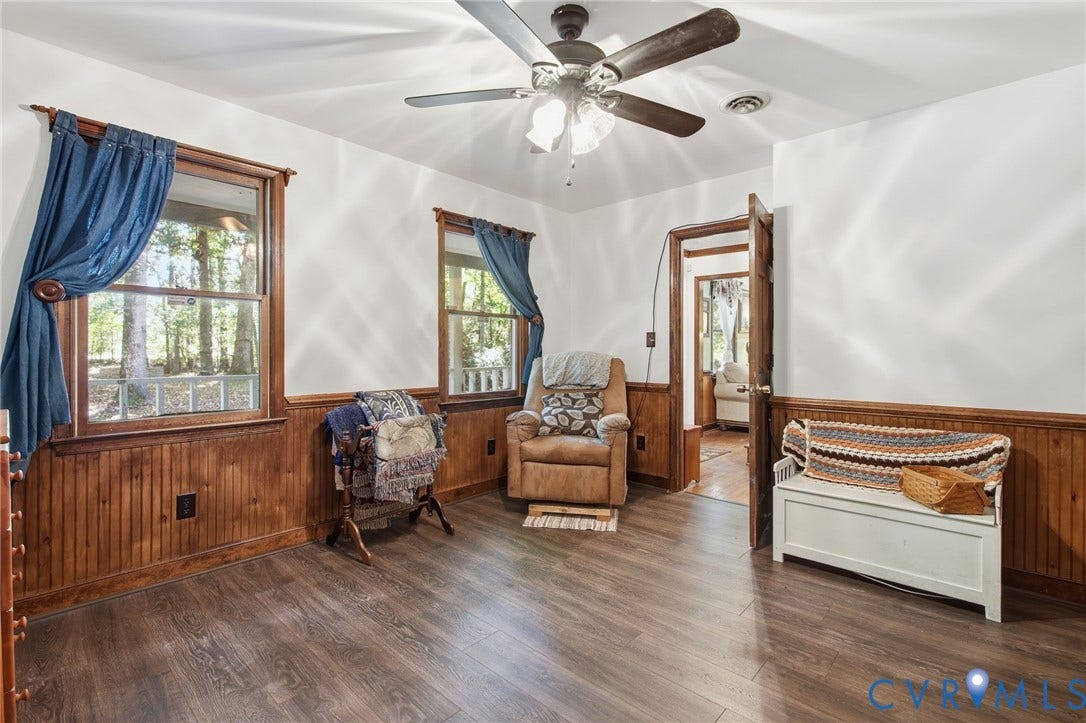 1330 Ruffin Mill Road, South Chesterfield, VA 23834 Interior space featuring wood-finish flooring, wood wainscoting, and a multi-blade ceiling fan with integrated lighting
