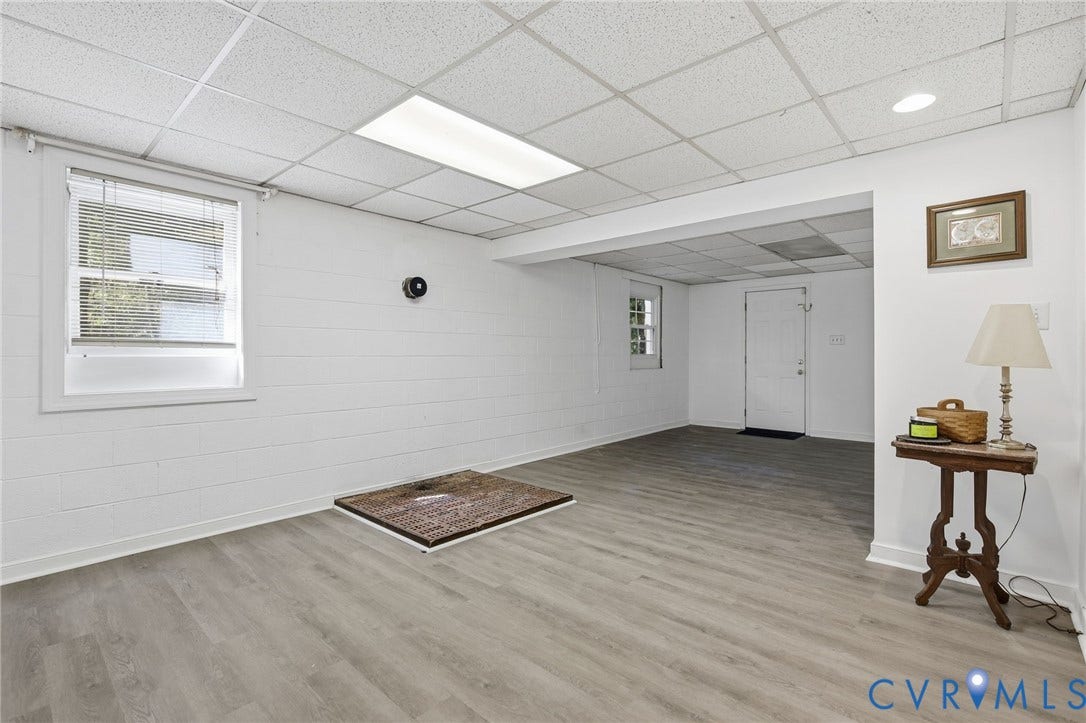 1330 Ruffin Mill Road, South Chesterfield, VA 23834 Finished interior space featuring wood-finish flooring, painted masonry walls, recessed drop-ceiling tiles, and multi-paned windows