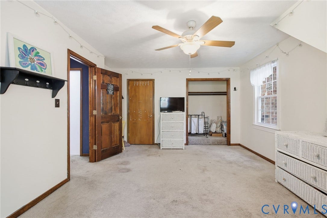 1330 Ruffin Mill Road, South Chesterfield, VA 23834 Carpeted room featuring a ceiling fan with light fixture, multi-pane window, and wood-finish interior doors