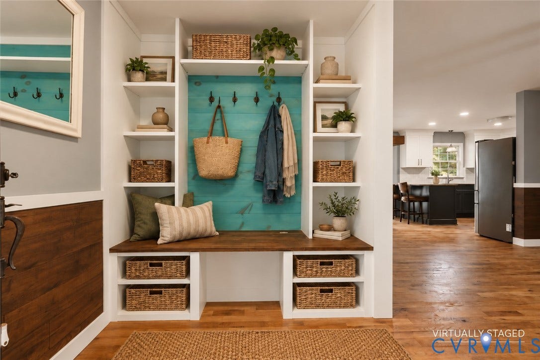 4350 Steger Creek Drive, Powhatan, VA 23139 Built-in mudroom organization featuring white cabinetry, a wood-finish bench, matte black hardware, and wood-finish flooring