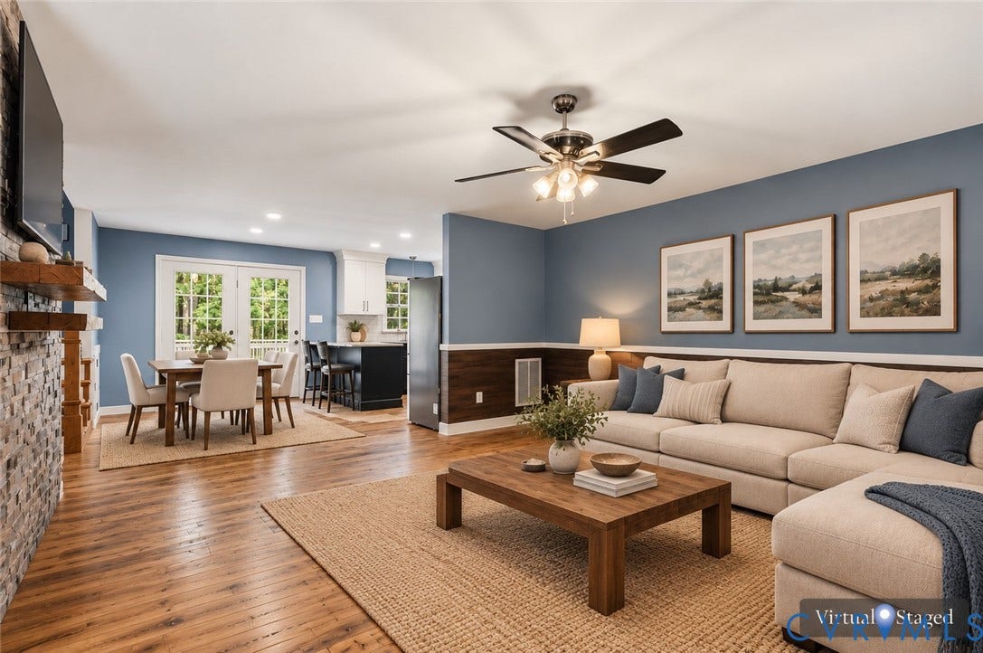 4350 Steger Creek Drive, Powhatan, VA 23139 Wood-finish flooring, floor-to-ceiling stone-veneer fireplace, wood-panel wainscoting, glass-paneled double doors, and ceiling fan with integrated lighting