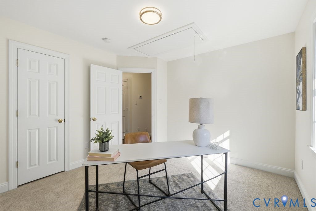 8477 Cheraw Road, Mechanicsville, VA 23116 Neutral-toned carpeting, six-panel interior doors, and a recessed ceiling light fixture