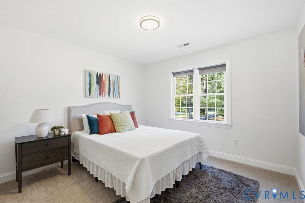 8477 Cheraw Road, Mechanicsville, VA 23116 Neutral-toned wall-to-wall carpeting, double-pane grid windows, and circular flush-mount ceiling lighting