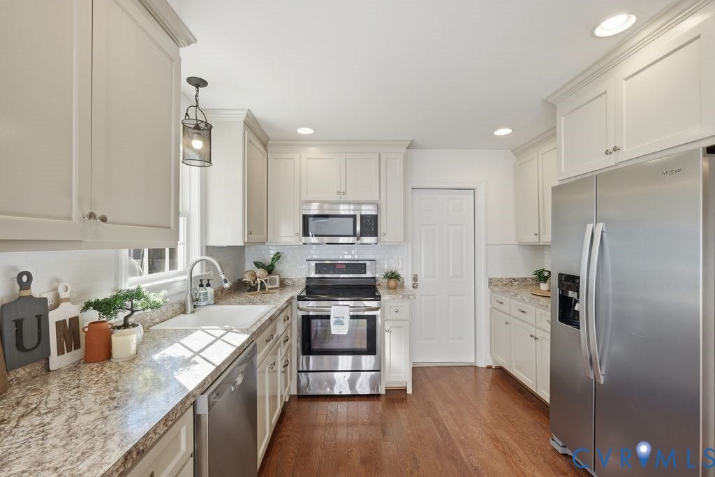 8477 Cheraw Road, Mechanicsville, VA 23116 Kitchen featuring off-white cabinetry, stone-patterned countertops, stainless steel appliances, recessed lighting, and wood-finish flooring