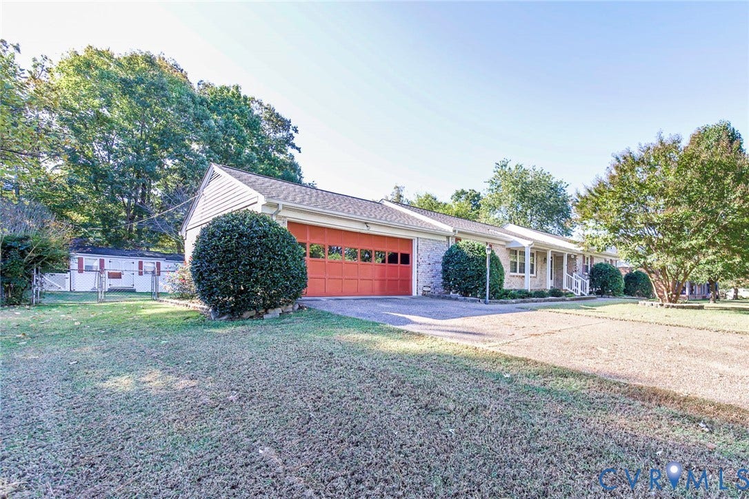 4511 Inca Drive, Ampthill, VA 23237 Single-story exterior featuring a brick and siding facade, an attached two-car garage with carriage-style doors, a concrete driveway, and covered front entry