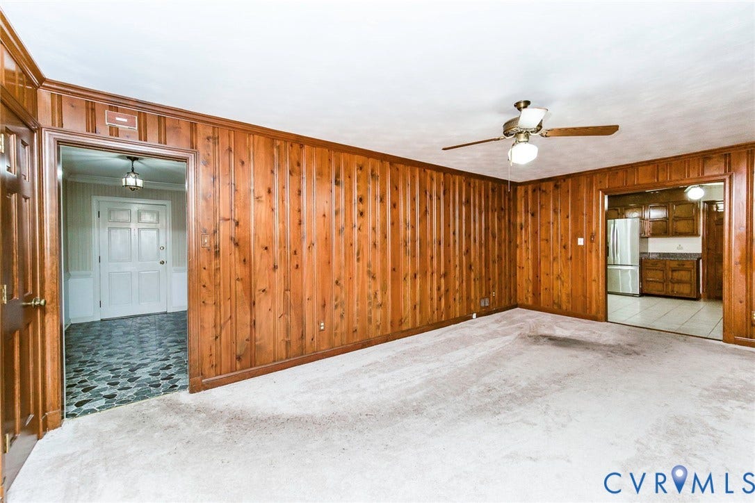 4511 Inca Drive, Ampthill, VA 23237 Interior space featuring wood paneling, a ceiling fan with integrated lighting, and wall-to-wall carpeting