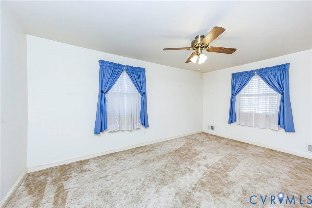 4511 Inca Drive, Ampthill, VA 23237 Neutral-toned wall finish, wall-to-wall carpeting, dual windows with integrated blinds, and a ceiling-mounted fan with light fixture