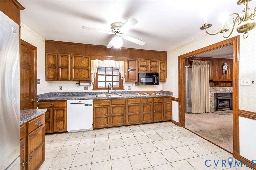 4511 Inca Drive, Ampthill, VA 23237 Kitchen featuring stained wood cabinetry, stone-finish countertops, ceramic tile flooring, a built-in microwave, and a ceiling fan with integrated lighting