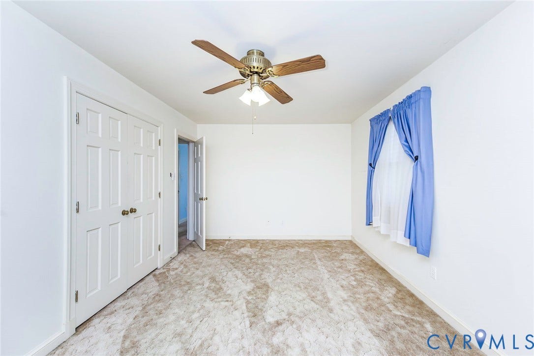4511 Inca Drive, Ampthill, VA 23237 Neutral-toned carpeted flooring, multi-panel closet doors, and a ceiling-mounted fan with integrated lighting