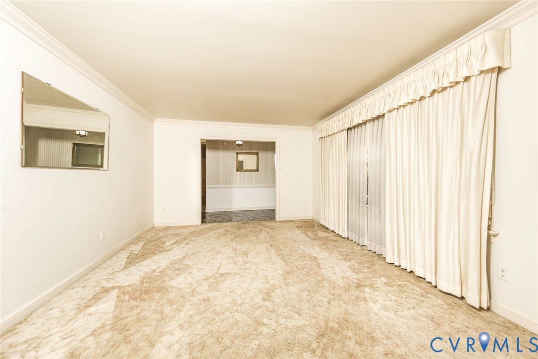 4511 Inca Drive, Ampthill, VA 23237 Neutral wall palette featuring crown molding, wall-to-wall carpeting, and floor-to-ceiling window drapery