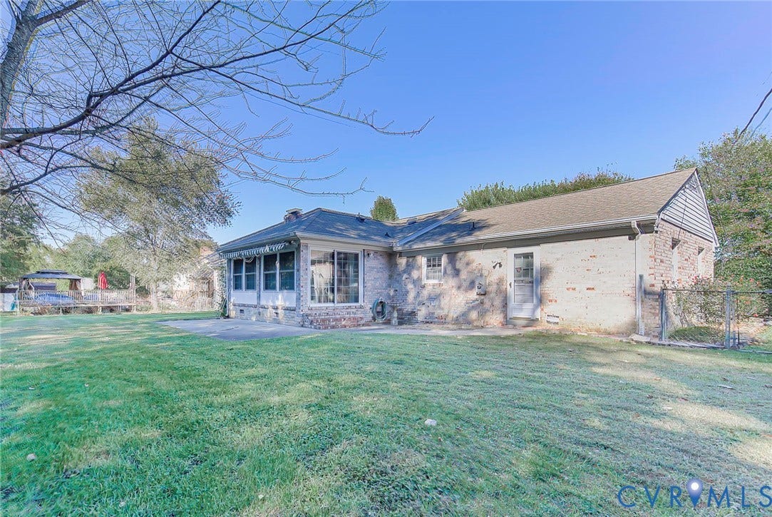 4511 Inca Drive, Ampthill, VA 23237 Exterior featuring brick siding, a rear patio, sliding glass doors, a multi-pane window sunroom, and fenced outdoor space