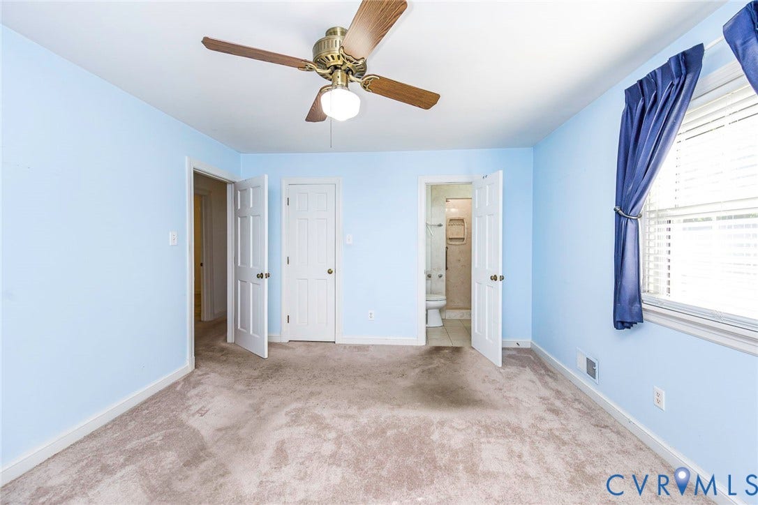 4511 Inca Drive, Ampthill, VA 23237 Room interior featuring wall-to-wall carpeting, a ceiling fan with integrated lighting, and multiple six-panel interior doors