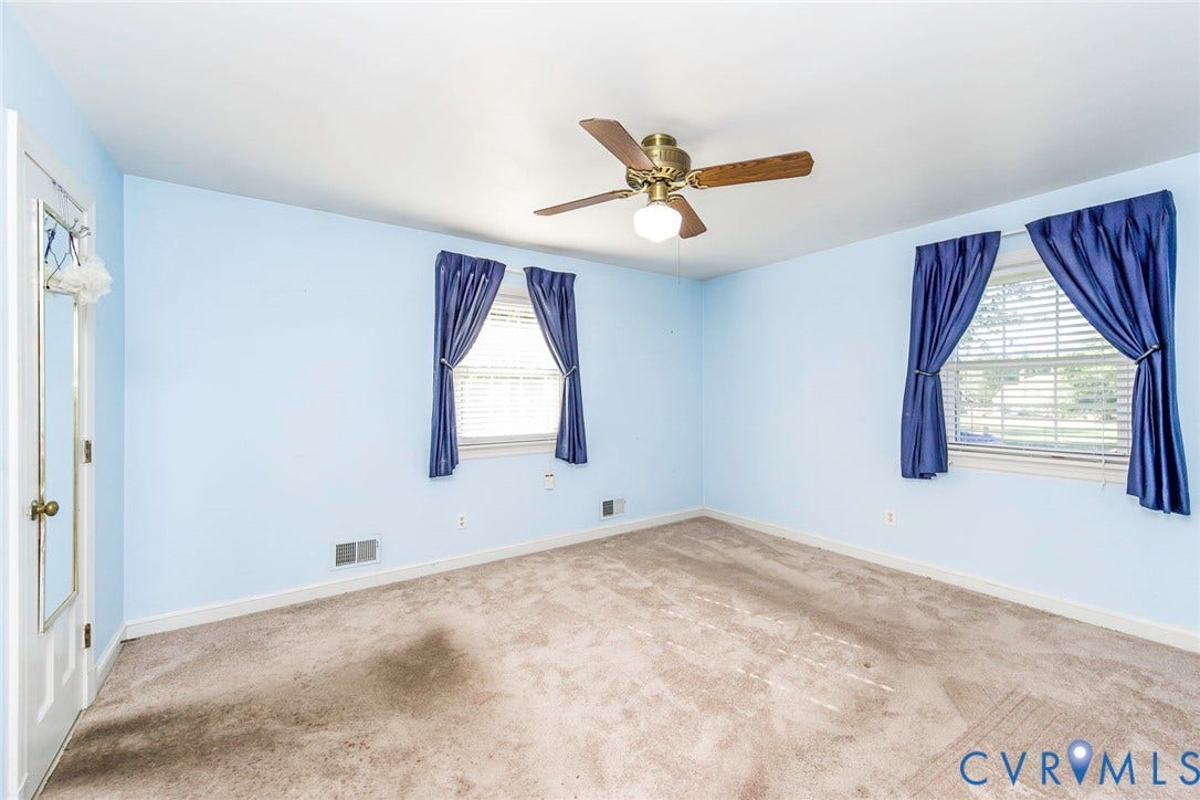 4511 Inca Drive, Ampthill, VA 23237 Room featuring carpeting, two windows with horizontal blinds, and a ceiling fan with integrated lighting