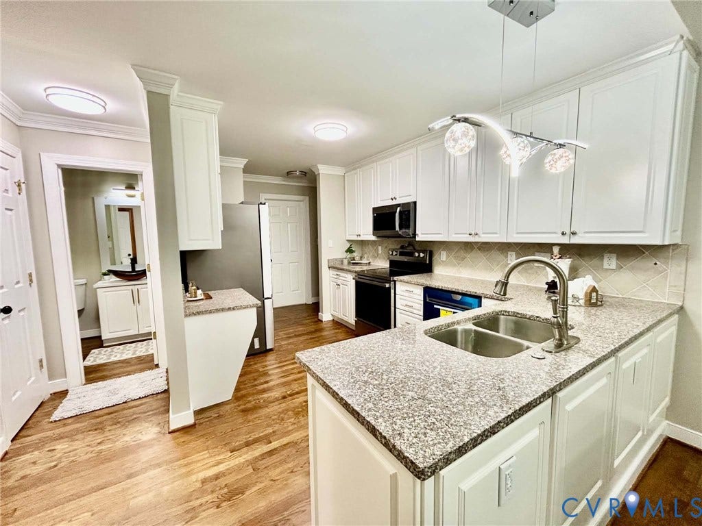 2255 Oak Bay Lane, Henrico, VA 23233 Kitchen featuring white cabinetry, stone-finish countertops, stainless steel appliances, a multi-globe pendant light fixture, and wood-finish flooring