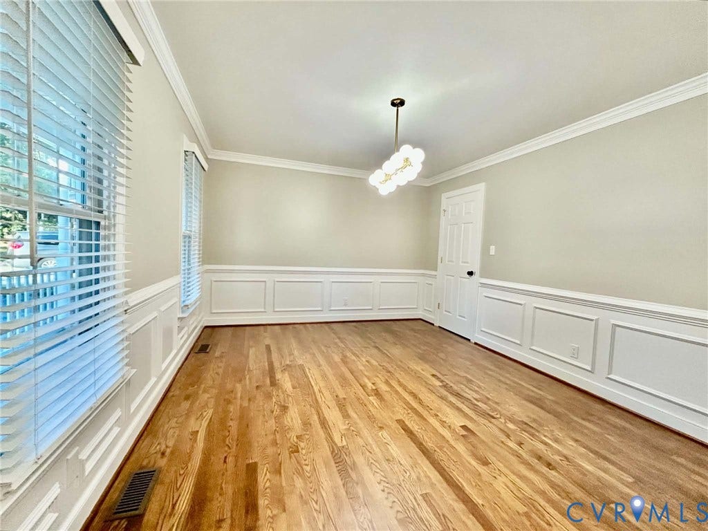 2255 Oak Bay Lane, Henrico, VA 23233 Interior space featuring wood-finish flooring, white wainscoting, crown molding, and a multi-globe light fixture