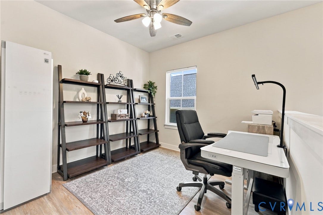 1716 German School Road, Westlake Heights, Richmond, VA 23225 Multi-use interior space featuring wood-finish flooring, a single-hung window, and a ceiling fan with integrated lighting