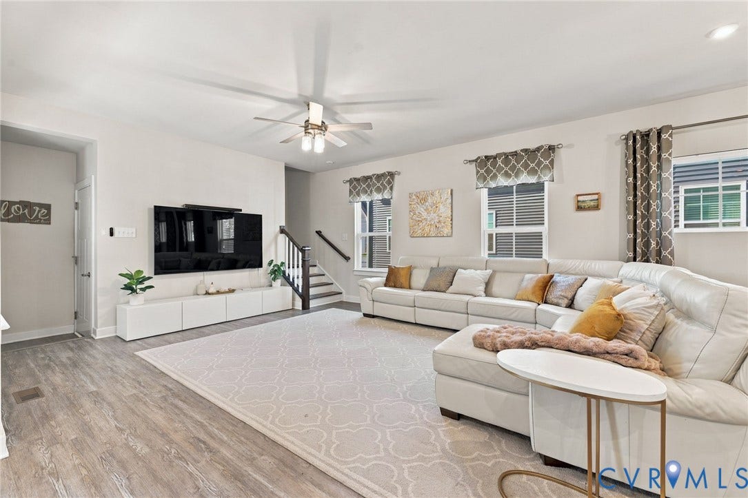 1716 German School Road, Westlake Heights, Richmond, VA 23225 Living area featuring wood-finish flooring, recessed lighting, a multi-blade ceiling fan with integrated light, and windows with top-mounted treatments