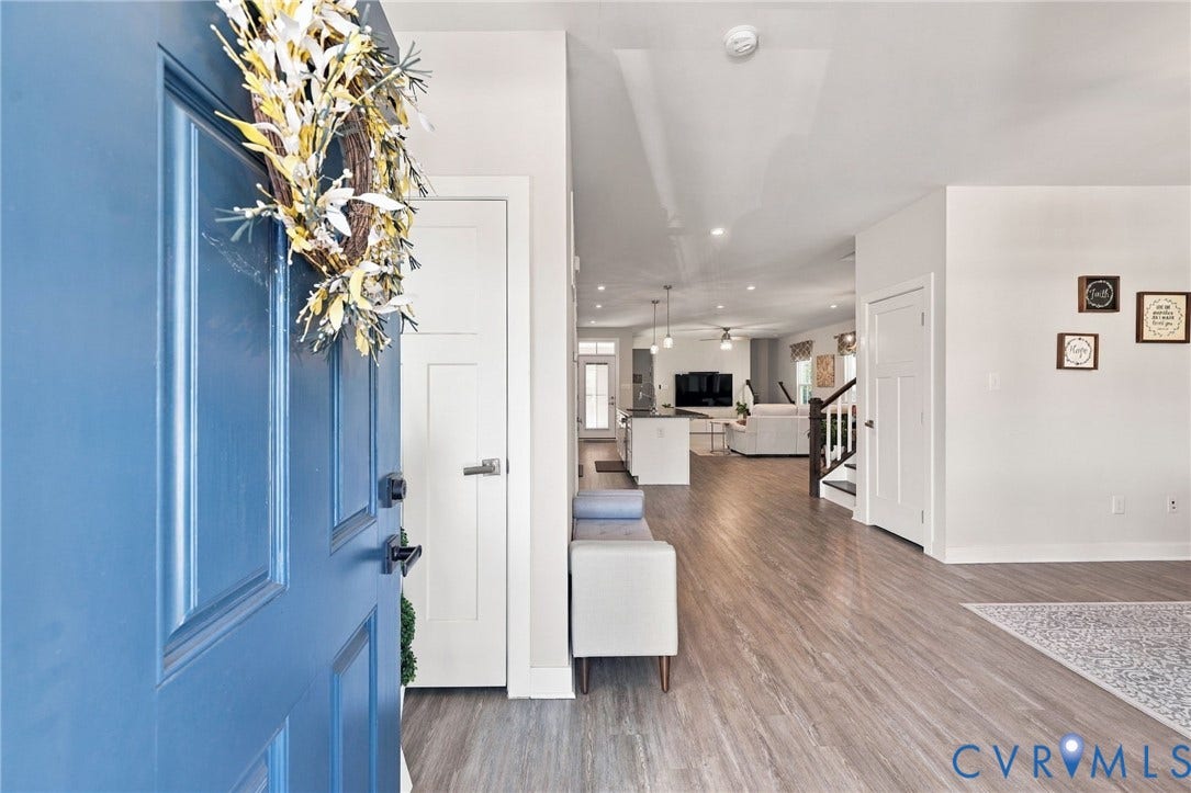 1716 German School Road, Westlake Heights, Richmond, VA 23225 Blue entry door featuring a multi-panel design, wood-finish flooring, and recessed ceiling lighting