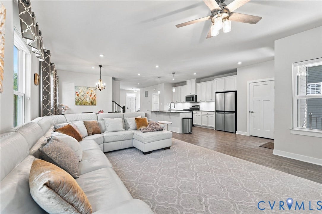 1716 German School Road, Westlake Heights, Richmond, VA 23225 Open-concept living space featuring wood-finish flooring, white cabinetry, stainless steel appliances, recessed lighting, and a ceiling fan