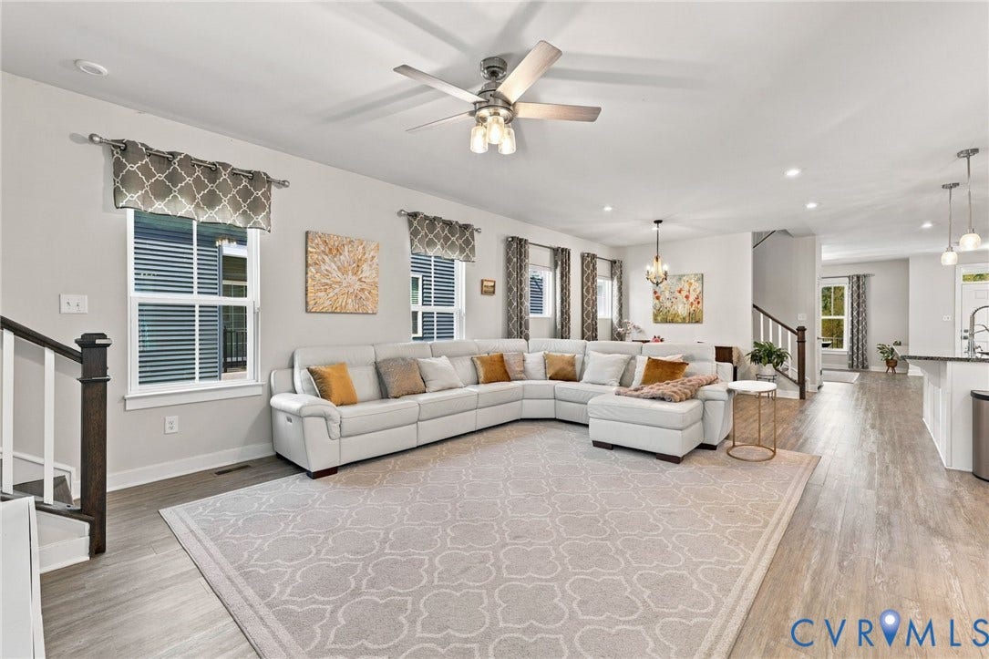 1716 German School Road, Westlake Heights, Richmond, VA 23225 Open-concept interior featuring wood-finish flooring, recessed lighting, a modern ceiling fan, and large windows with natural light