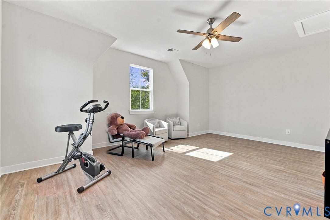 1716 German School Road, Westlake Heights, Richmond, VA 23225 Neutral-toned walls, wood-finish flooring, single-hung window, and ceiling fan with integrated lighting