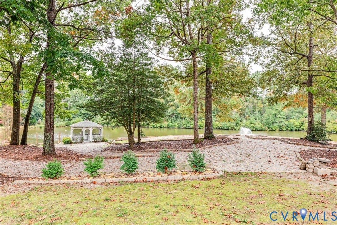 6650 Vintage Rose Lane, New Kent, VA 23140 Beautiful view of the extensive hardscaping and landscaping, fountain in the pond and gazebo