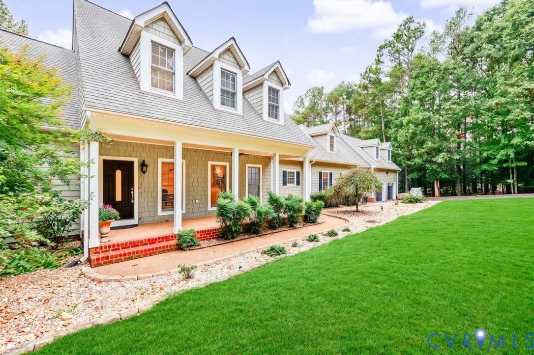 6650 Vintage Rose Lane, New Kent, VA 23140 Exterior featuring a shingle-style facade, gabled dormers, an expansive covered porch with brick steps, and a manicured lawn